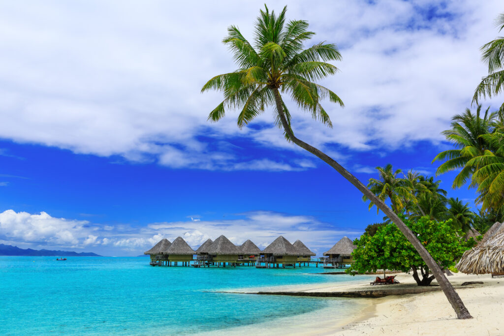 Over-water bungalows of luxury tropical resort, Bora Bora island, near Tahiti, French Polynesia, Pacific ocean